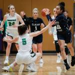 Glacier Peaks Aaliyah Collins (22) looks for an open teammate after grabbing a loose ball. (Andy Bronson / The Herald)