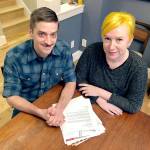Husband and wife Andy Kraft and Amy Elias, of Portland, Oregon, with their 2018 tax paperwork. (AP Photo/Gillian Flaccus)