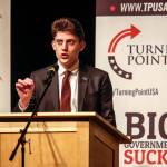 Marjory Stoneman Douglas High School student Kyle Kashuv speaks to an audience at Jackson High School on Wednesday night about gun control and school shootings. Kashuv is a gun-rights advocate and survivor of a Florida school shooting in 2018. (Dan Bates / The Herald)