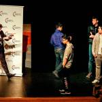 Speaker Kyle Kashuv greets a group of boys who came up on stage to take photos with him following his talk about gun rights and school shootings. (Dan Bates / The Herald)