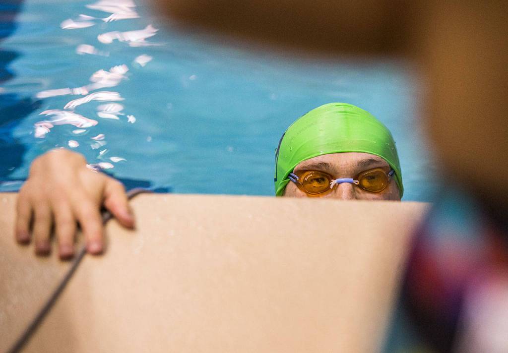 Shorewoods Cole Nouwens looks at his teammates after finishing the 100 Yard Breaststroke during the 3A Boys Swim/Dive Championships on Saturday, Feb. 16, 2019 in Federal Way, Wash. (Olivia Vanni / The Herald)