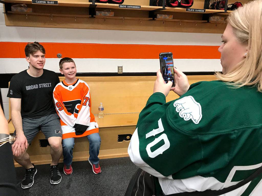 Connor Parkkila poses for a photo Saturday with his idol, Philadelphia Flyers rookie goalkeeper Carter Hart. (Photo courtesy of Philadelphia Flyers)