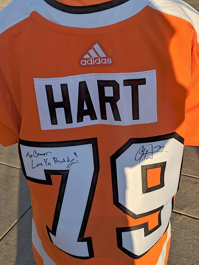 Connor Parkkila wears a jersey signed by Philadelphia Flyers goalkeeper Carter Hart. (Parkkila family photo)