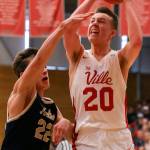 Marysville Pilchucks Luke Dobler attempts a shot wth Kelsos Dillon Davis defending during a state regional boys basketball game Feb. 23 at Everett Community College. The Tomahawks won 72-51. (Kevin Clark / The Herald)