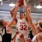 Marysville Pilchucks Aaron Kalab attempts a shot with Kelsos Drew Tack (left) defending during a state regional boys basketball game Feb. 23 at Everett Community College. The Tomahawks won 72-51. (Kevin Clark / The Herald)