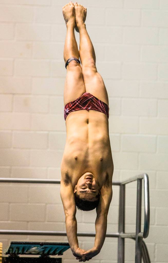 Cascades Joseph Hofman competes in Men 1 Meter Diving during during the 4A Boys Swim/Dive Championships on Feb. 16 in Federal Way. (Olivia Vanni / The Herald)