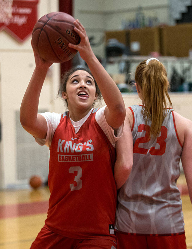 Jada Wynn steps around a teammate for a layup during Mondays practice. (Andy Bronson / The Herald)