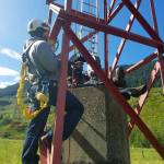 Contractors work on one of the 35 antenna towers at Jim Creek Naval Radio Station near Arlington in 2012. (U.S. Navy photo by Robin Hicks)