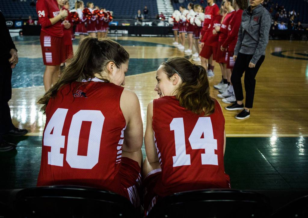 Snohomishs Courtney Perry and Snohomishs Maya DuChesne wait for their names to be called before the start of the game against Seattle Prep at the 3A Girls Hardwood Classic on Wednesday, Feb. 27, 2019 in Tacoma, Wash. (Olivia Vanni / The Herald)
