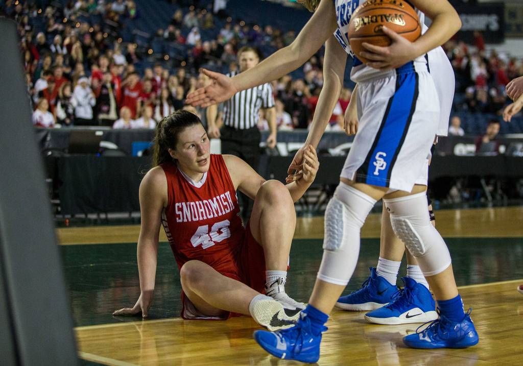 Snohomishs Courtney Perry gets help up after being fouled during the game against Seattle Prep at the 3A Girls Hardwood Classic on Wednesday, Feb. 27, 2019 in Tacoma, Wash. (Olivia Vanni / The Herald)