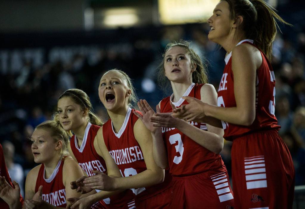 The Snohomish bench looks at the scoreboard and cheers during the game against Seattle Prep at the 3A Girls Hardwood Classic on Wednesday, Feb. 27, 2019 in Tacoma, Wash. (Olivia Vanni / The Herald)
