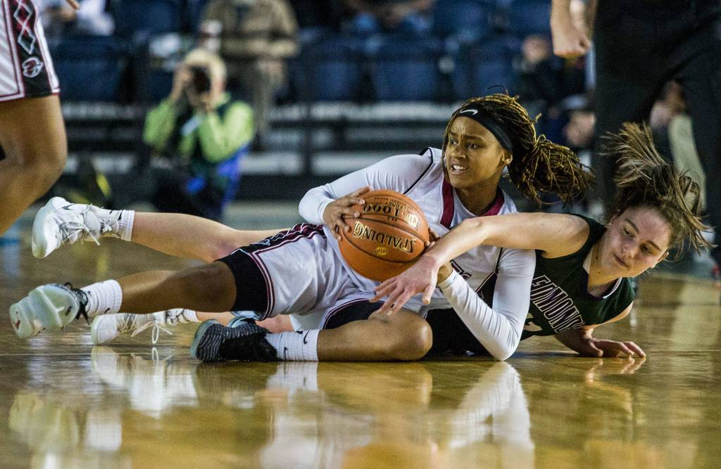 Edmonds-Woodways Ingrid Fosberg fights Bethels Sky Lett for the ball during the game against Bethel at the 3A Girls Hardwood Classic on Wednesday, Feb. 27, 2019 in Tacoma, Wash. (Olivia Vanni / The Herald)