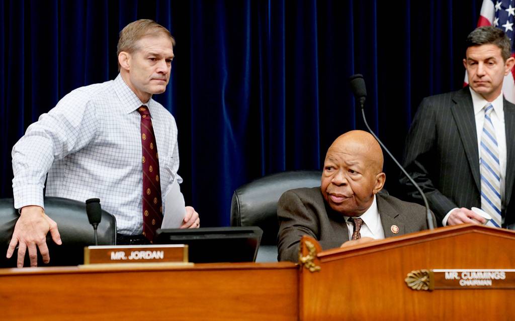 Rep. Jim Jordan of Ohio (left), the House Oversight and Reform Committee ranking Republican, takes his seat next to Chairman Elijah Cummings, D-Maryland, for a hearing of the House Oversight and Reform Committee on Capitol Hill in Washington.(AP Photo/J. Scott Applewhite)