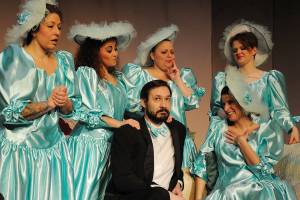 Wedding usher Tripp played by Ben St. Hilaire attracts the attention of the five bridesmaids, from left: Codie Wyatt, Jeryn Pasha, Rita Baxter, Bethany Roddy, Lydia ODay in Red Curtains Five Women Wearing the Same Dress. The show opens March 1 at the Marysville theater. (Larry T. Lisk)