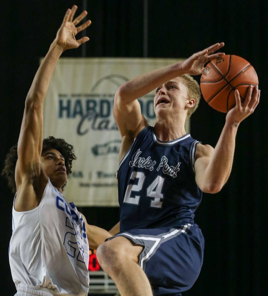 Glacier Peaks Evan Mannes attempts a shot with Curtis Josiah Miller defending Wednesday afternoon at the Tacoma Dome on February 27, 2019. The Grizzles lost 46-43. (Kevin Clark / The Herald)