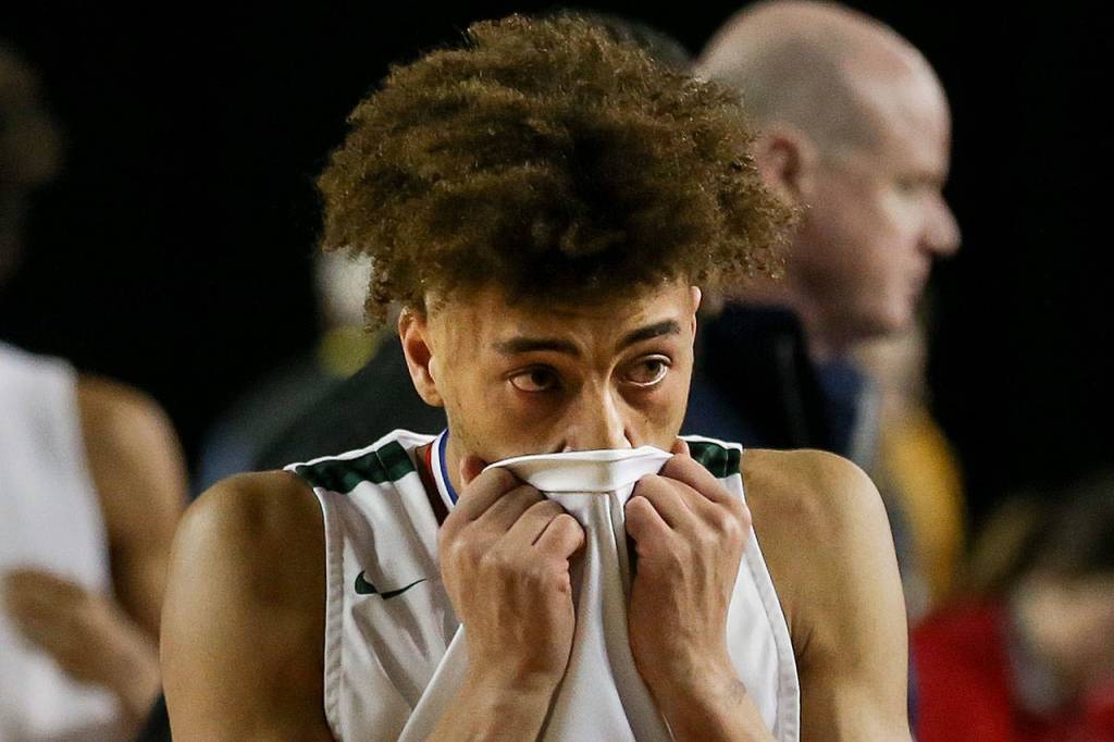Jacksons Christian Liddell leaves the court dejected after loosing to Puyallup Wednesday morning at the Tacoma Dome on February 27, 2019. The Timberwolves lost 56-50. (Kevin Clark / The Herald)