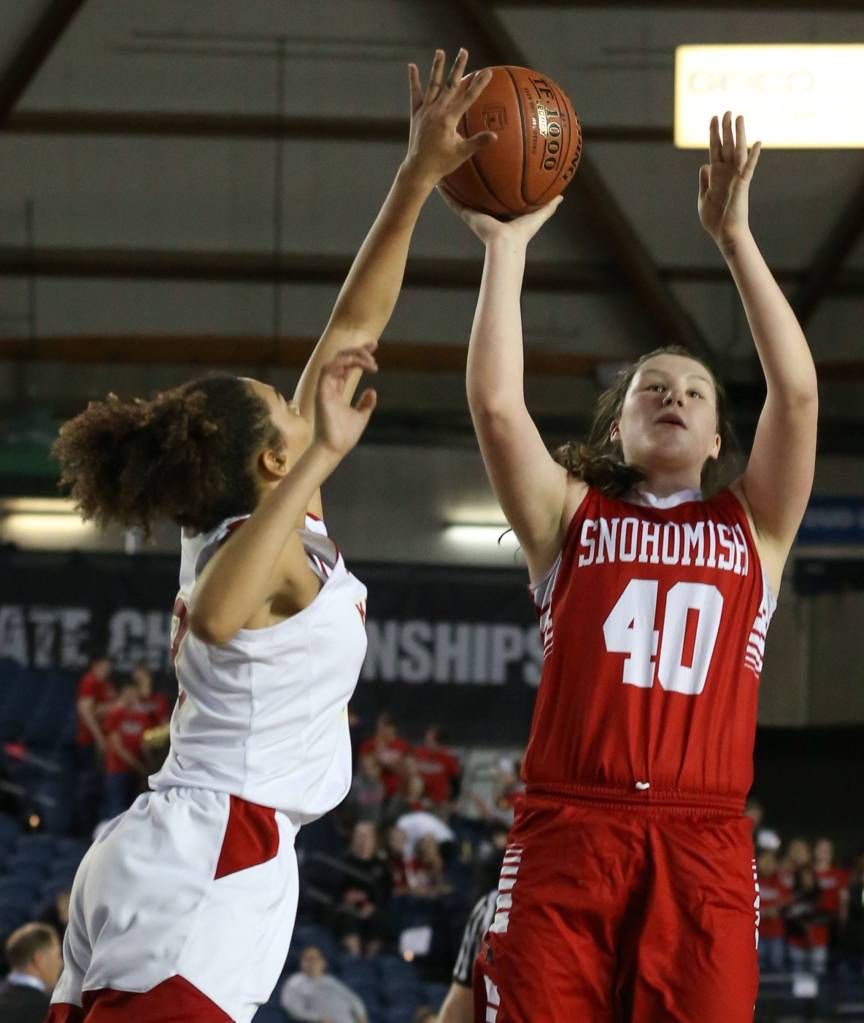 Kamiakins Symone Brown blocks Snohomishs Courtney Perry shot Thursday morning at the Tacoma Dome on February 28, 2019. The Panthers lost 57-39.(Kevin Clark / The Herald)