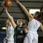Edmonds-Woodways AJ Martineau attempts a layup past Prairies Haley Reed (left) and Meri Dunford Thursday morning at the Tacoma Dome on February 28, 2019. The Warriors lost 58-39.(Kevin Clark / The Herald)