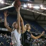 Prairies Kendyl Carson and Edmonds-Woodways Kristen Reijonen jump for a rebound Thursday morning at the Tacoma Dome on February 28, 2019. The Warriors lost 58-39.(Kevin Clark / The Herald)