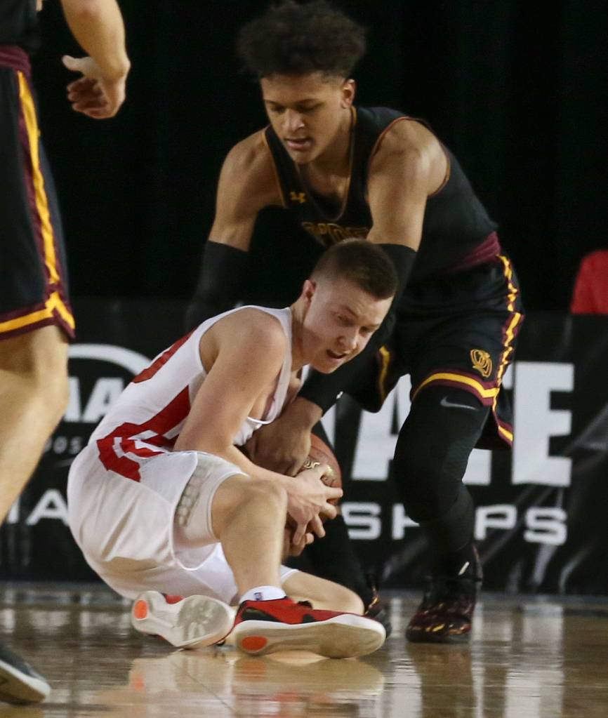 Marysville-Pilchucks Luke Dobler locks up ODea Paolo Banchero for a jump ball Thursday afternoon at the Tacoma Dome on February 28, 2019. The Tomahawks lost 63-53. (Kevin Clark / The Herald)