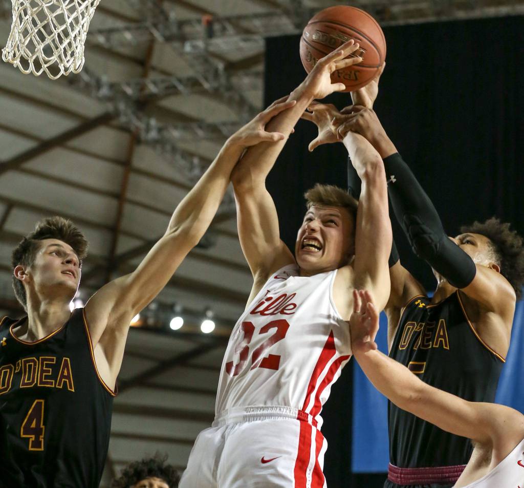 Marysville-Pilchucks Aaron Kalab attempts a rebound with ODea John Misel (left) and ODea Paolo Banchero knocking it loose Thursday afternoon at the Tacoma Dome on February 28, 2019. The Tomahawks lost 63-53. (Kevin Clark / The Herald)