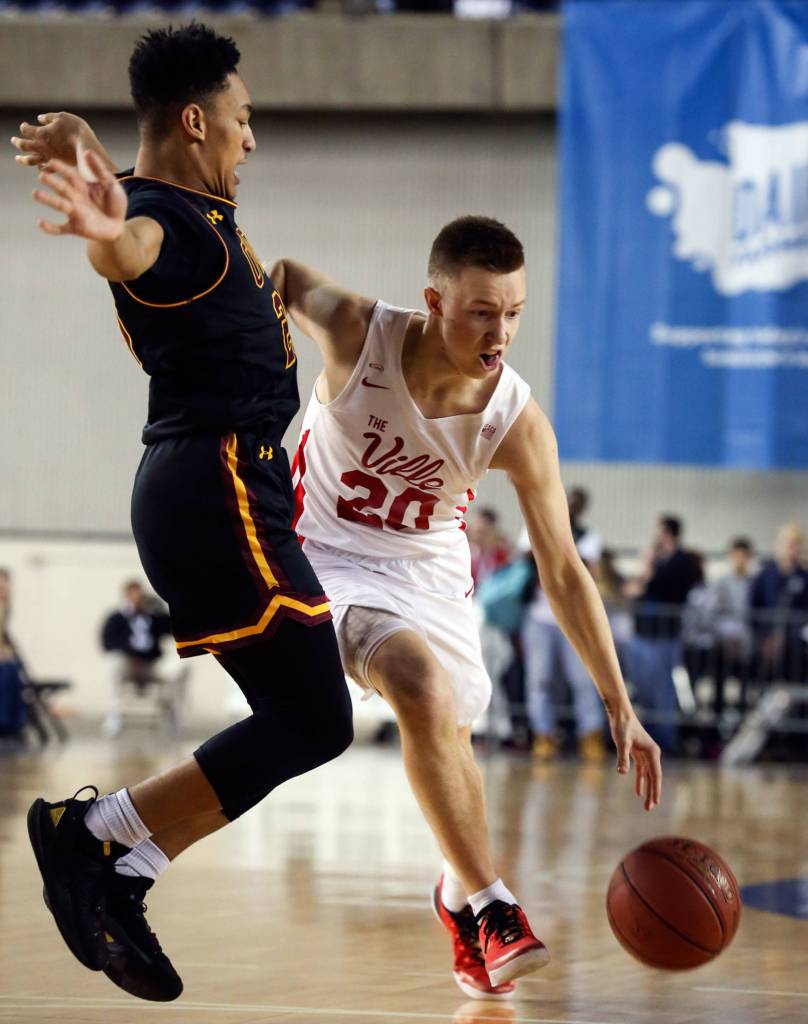 ODea Dezjay Perkins applies pressure to Marysville-Pilchucks Luke Dobler Thursday afternoon at the Tacoma Dome on February 28, 2019. The Tomahawks lost 63-53. (Kevin Clark / The Herald)