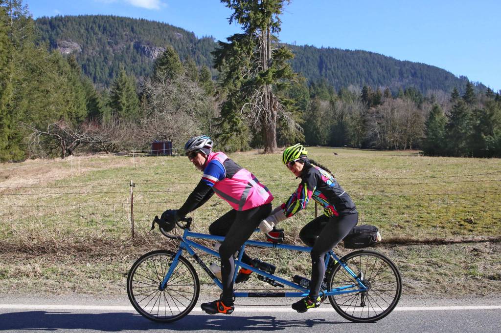 Bikers trek the scenic hills and turns of Jordan Road outside Arlington Sunday afternoon on March 3, 2019. (Kevin Clark / The Herald)