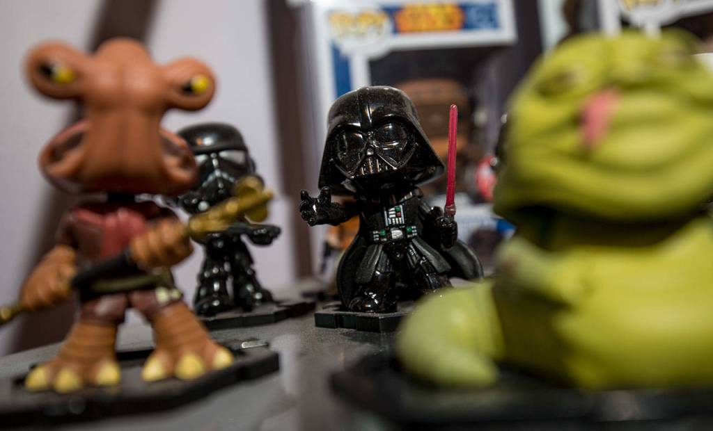 A rare Darth Vader among other Star Wars characters sits on a shelf. (Andy Bronson / The Herald)