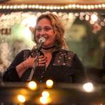 Renata Lubinsky performs stand-up during open mic night at Ould Triangle in Seattle. (Kevin Clark / The Herald)
