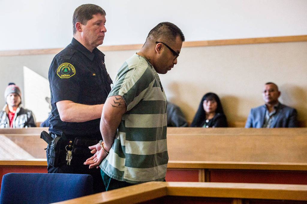 Saravouth Sun is led out of the courtroom after the sentencing for the 2005 shooting of Jesse Williams. (Olivia Vanni / The Herald)