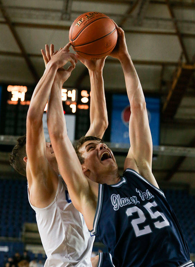 Glacier Peaks Noah Forman (right) and Curtis Zack Paulsen jump for a rebound during a Hardwood Classic game Feb. 27 at the Tacoma Dome. (Kevin Clark / The Herald)
