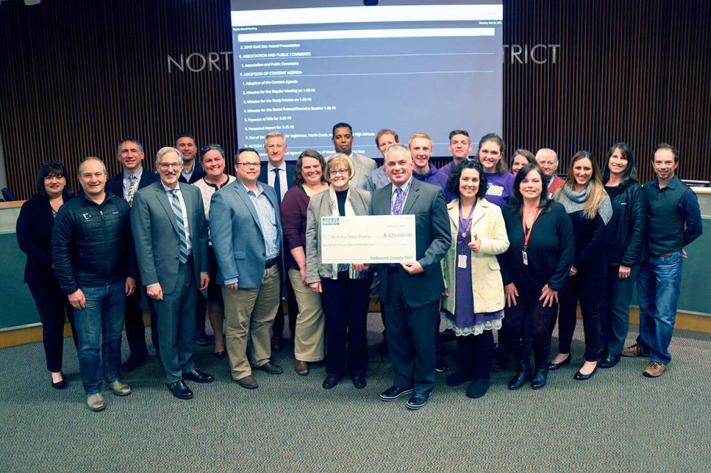 Front row (left to right): Tim Jewitt, Dykeman Architects; David Cogan, Northshore School Board Director; Doug ODonnell, Snohomish County PUD Executive Account Manager; Allison Grinczel, Snohomish County PUD Engineer; Toni Olson, Snohomish County PUD Commissioner; Eric McDowell, North Creek High School Principal; Naudia Bosch, North Creek High School ASB and Director of Activities; Traci Rogstad, Director of Capital Projects. Back row (left to right): Amy Stenvall, Capital Projects Assistant Budget Coordinator; Joe Paperman, Chief Operating Officer; Robert Foster, Director of Support Services; Dr. Michelle Reid, Superintendent; Bob Swain, Northshore School Board Director; Rick Ferrell, North Creek High School Assistant Principal; Joseph Robertson, North Creek High School Assistant Principal; TJ Ingersoll, North Creek High School ASB President; Kyle Wickline, North Creek High School ASB Officer; Hannah Urey, North Creek High School ASB Officer; Sandy Hayes, Northshore School Board President; Jacqueline McGourty, Northshore School Board Director; Melissa Pendleton, McKinstry; Trisha Sherman, Dykeman Architects; Brian Jenkins, McKinstry.