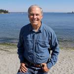 In this 2018 photo, Washington Gov. Jay Inslee poses for a photo on the beach near his home on Bainbridge Island. (AP Photo/Ted S. Warren)