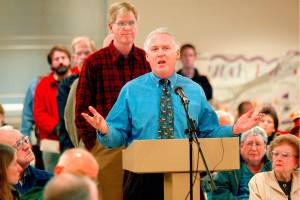 Dr. Scott Casselman speaks out against airport expansion at Paine Field during a 2005 town hall meeting in Mukilteo. Now that commercial airline service has started, the Mukilteo resident hasnt changed his views. (Dan Bates / The Herald)
