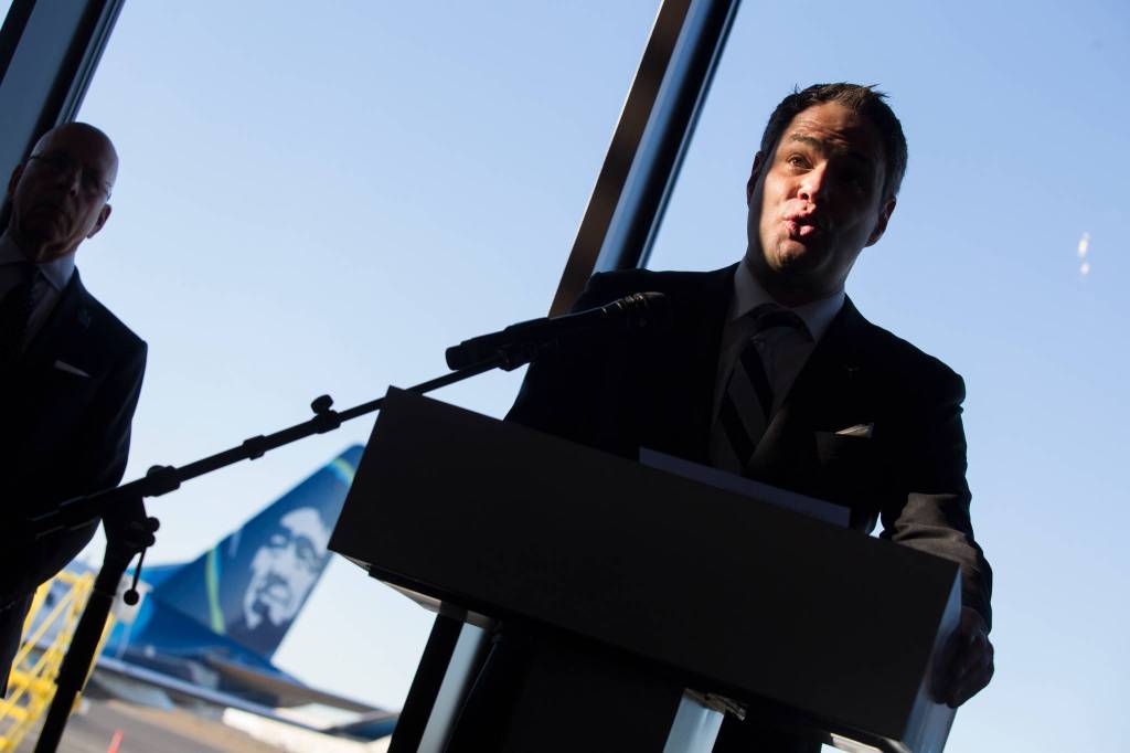 Propeller Airports Chief Executive Officer Brett Smith speaks to guests Monday during ceremonies to mark the opening day of the Paine Field Terminal in Everett. (Andy Bronson / The Herald)