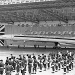 In this Dec. 11, 1967 photo, members of the French army band (front) and Royal air Force Band stand in front of the British-French supersonic airliner Concorde during its official presentation in Toulouse, France. (AP Photo/Peter Kem, File)