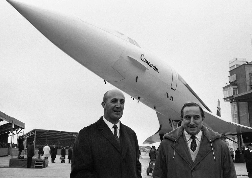 In this Dec. 11, 1967 photo, test pilots Andre Turcat (right) of France and British pilot Brian Trubshaw (left) stand in front of the prototype of the jet during its roll out ceremony in Toulouse, France. (AP Photo/Peter Kemp, File)