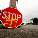 A stop sign was defaced with a spray-painted swastika at the corner of 25th Street and Rucker Avenue in 2009. (Dan Bates / Herald file)