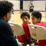 RaeQuan Battle (left) talks with JJ Gray and Tayari Williams-Archibald at the Tulalip Boys & Girls Club in January. Battle, a proud Tulalip Tribes member, is believed to be the first from his tribe to receive a Division-I college basketball scholarship. (Kevin Clark / The Herald)