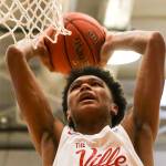 RaeQuan Battle slams home a dunk in a state regional win over Kelso on Feb. 23. Highlight-reel plays were a common occurrence during the Marysville Pilchuck standouts spectacular senior season. (Kevin Clark / The Herald)