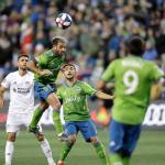 Sounders midfielder Nicolas Lodeiro (second from left) heads the ball during a match against FC Cincinnati on March 2, 2019, in Seattle. (AP Photo/Ted S. Warren)