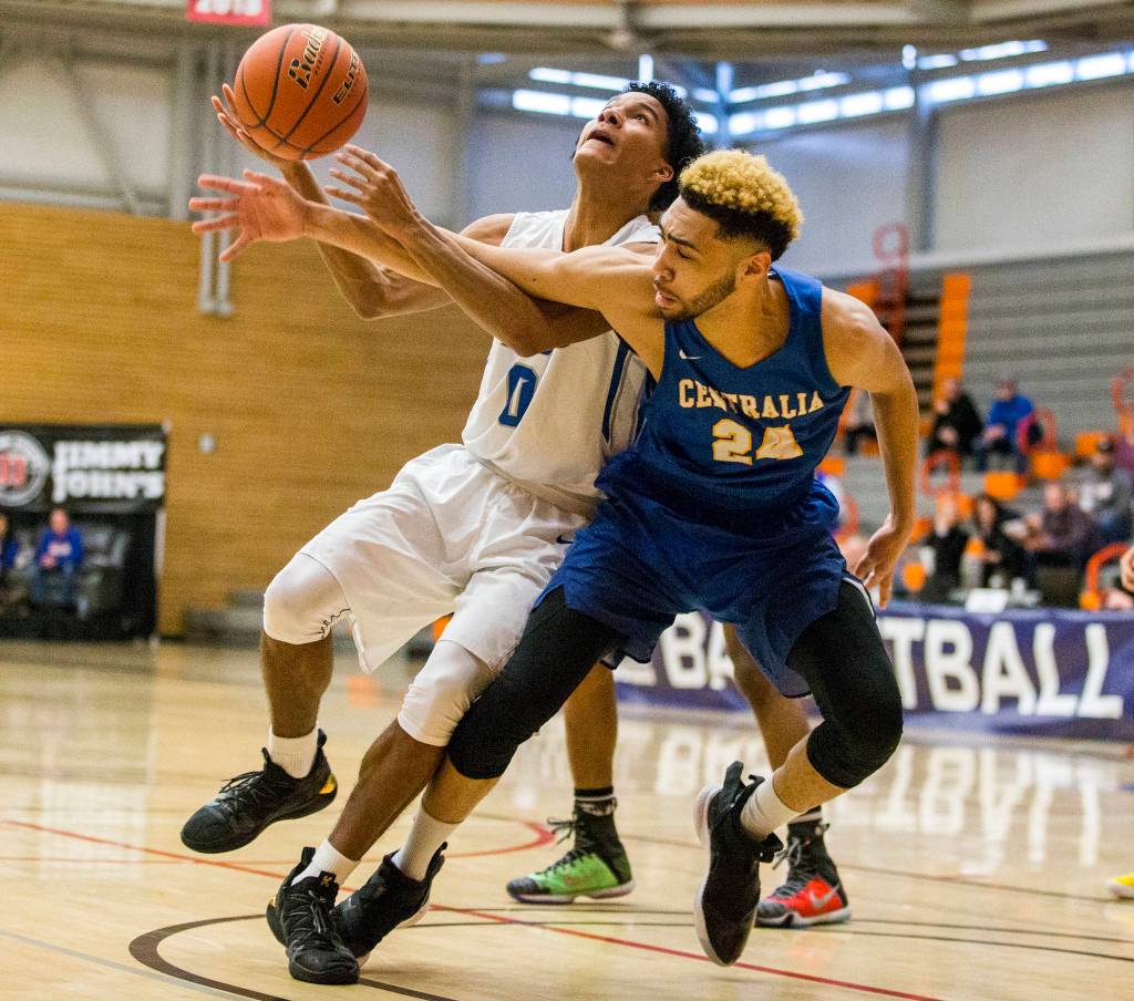 Centralias Marqus Gilson tries to block Edmonds Sean Kirks layup during NWAC mens basketball tournament on Thursday, March 7, 2019 in Everett, Wash. (Olivia Vanni / The Herald)