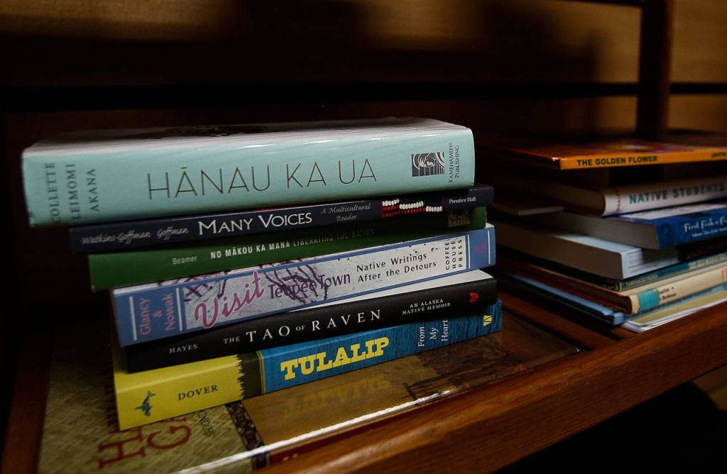 Books on Tulalip heritage and the Pacific Islands are stacked on shelves in a new space for Native American and Pacific Islander students at Everett Community College.(Dan Bates / The Herald)