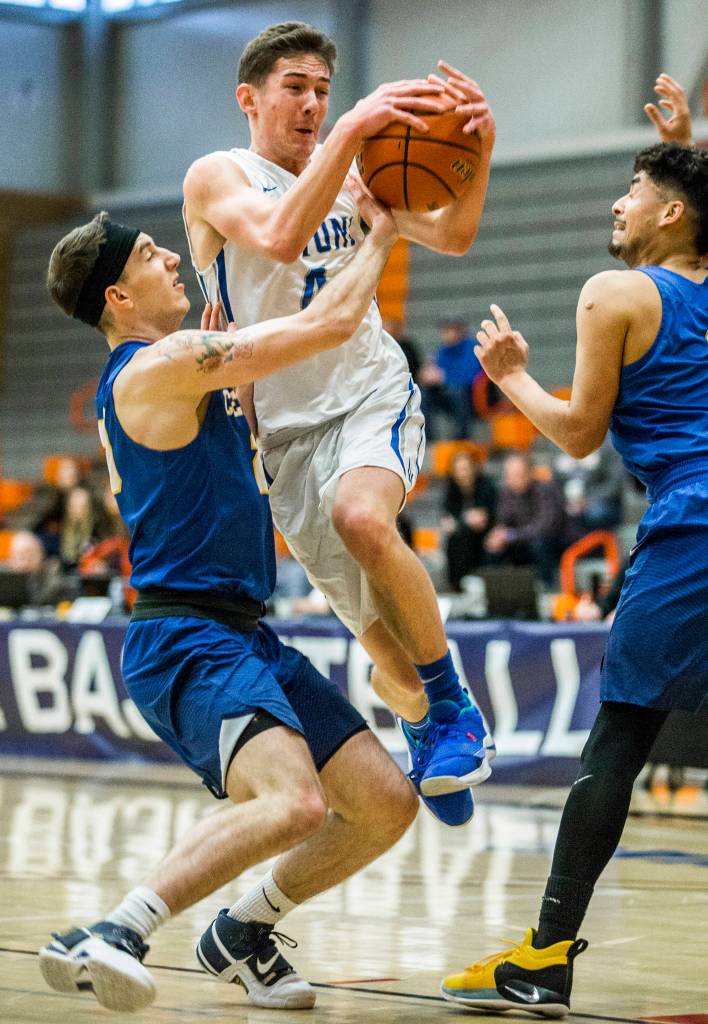 Edmonds Thomas Doyle attempts a layup during NWAC mens basketball tournament game against Centralia on March 7 in Everett. (Olivia Vanni / The Herald)