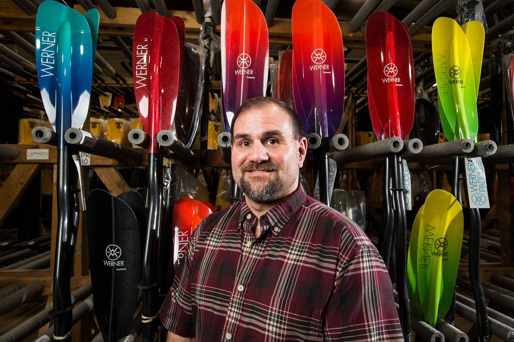 Werner Paddles Vice-President Don McClain poses with paddles on Feb. 22 in Monroe. (Andy Bronson / The Herald)
