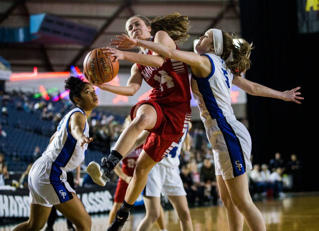 Maya DuChesne attempts a layup against Seattle Prep in the opening round of the 3A Hardwood Classic in the Tacoma Dome. In the closing seconds of the contest, she made a game-winning 3-pointer to send Snohomish to the state quarterfinals. (Olivia Vanni / The Herald)