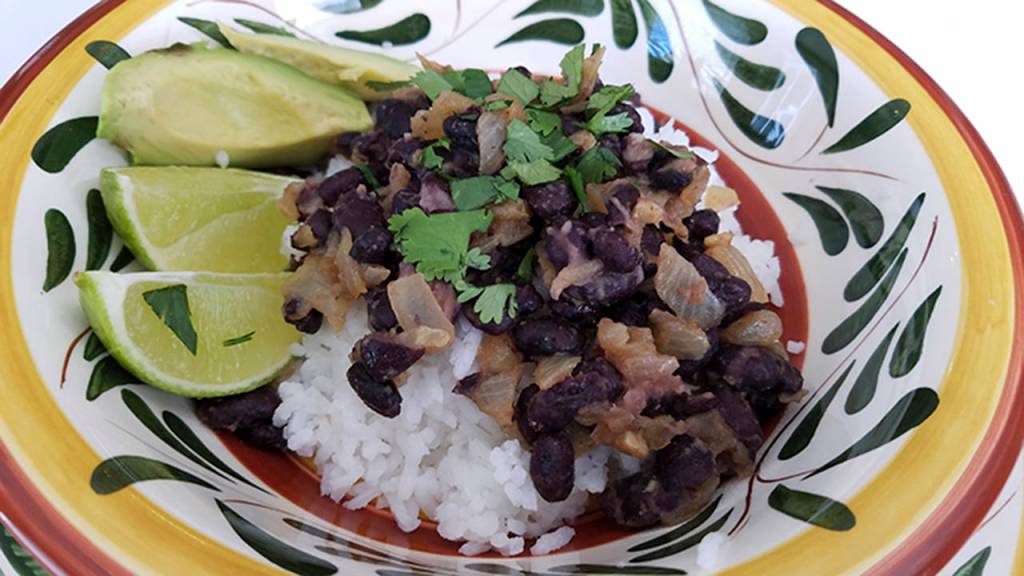 This no-recipe-recipe for rice and beans is made with orange juice, fresh cilantro and ground cumin. (Sharon Salyer/The Herald)