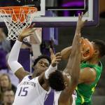 Washington forward Noah Dickerson (15) battles with Oregon forward Francis Okoro (right) for a rebound during a game on March 9, 2019, in Seattle. (AP Photo/Ted S. Warren)