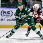 The Silvertips Wyatte Wylie looks for a teammate to pass to with Prince Georges Kody McDonald trailing during a game in 2017. Wylie, a Snohomish County native, was a sixth-round pick for the Silvertips in the 2014 bantam draft. (Kevin Clark / The Herald)
