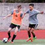 Lake Stevens Aiden Crook (left) controls the ball with Jaydon Digos defending Thursday afternoon at Caviler Mid High School in Lake Stevens on March 13, 2019. (Kevin Clark / The Herald)